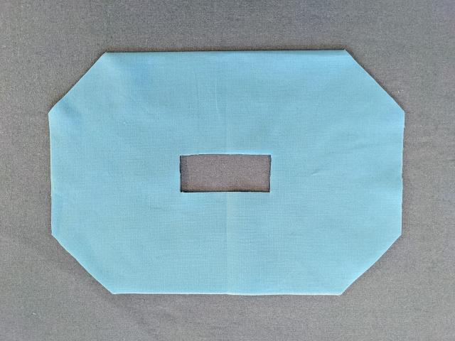blue fabric cut from pattern