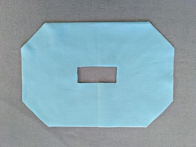 blue fabric cut from pattern